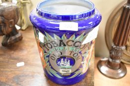 A reproduction tobacco jar in the Old Tom design