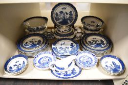 A selection of dinner and table wares by Doulton and Booths in the Real Old Willow design