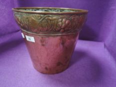 A Art Nouveau copper planter having grape and leaf rim design stamped for Keswick school of