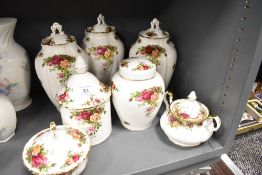 A selection of ceramic vase urns and jars by Royal Albert in the Old Country Roses design