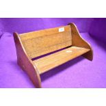 A vintage oak book trough or shelf