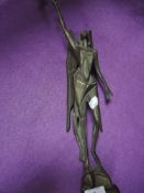 A bronze art deco geometric styled figure of an angel holding chalice atop a rocky outcrop 42cm