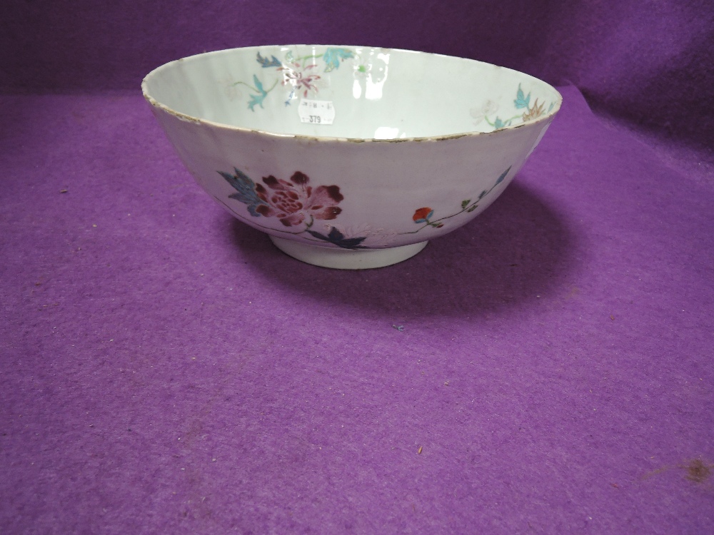An antique Chinese porcelain punch or slop bowl having hand decorated naturalistic design