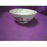 An antique Chinese porcelain punch or slop bowl having hand decorated naturalistic design