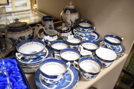 A selection of tea wares, cups and saucers by Doulton and Booths in the Real Old Willow design