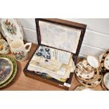 An inlaid antique mahogany case with needlework and haberdashery items