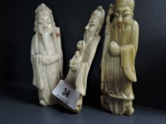 Three hand carved Chinese soap stone figures possibly immortals