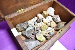 A selection of semi precious stones, rocks and minerals in an oak case
