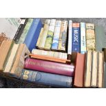 A selection of hard back text and reference books including adventure literature