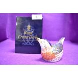 A ceramic Royal Crown Derby paper weight or figure of a Bluebird having gold stopper and box