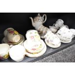 A selection of tea cups and saucers Beswick and Paragon country lane