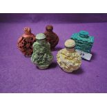 A selection of Chinese snuff bottles in cinnabar styles