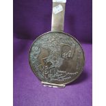 A Japanese brass cast mirror fan having scene of waterfall and carp with character inscription and