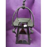 An arts and crafts lantern or light fitment having leaded light panels with painted metal and copper