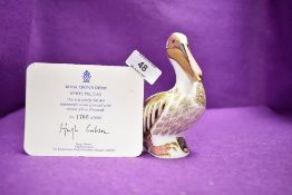 A Royal Crown Derby figural paper weight having gold stopper limited run White Pelican no, 1766 of