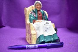A Royal Doulton figure study forty wink on green back stamp
