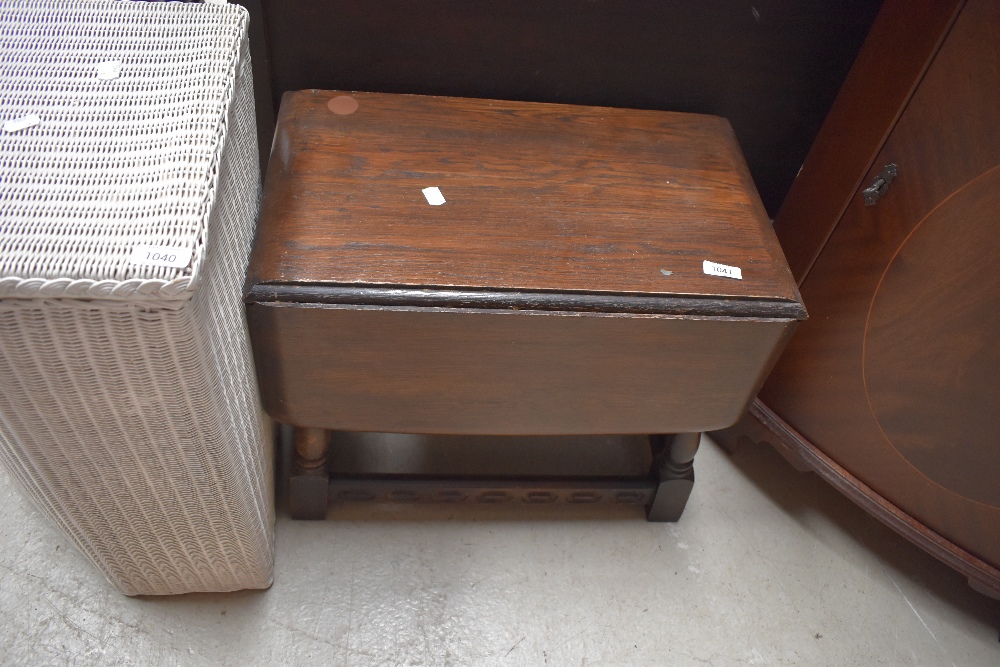 A dark stained Priory style occasional gateleg table