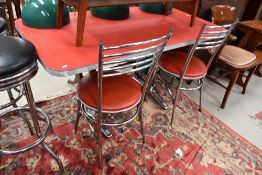 A vintage American diner style table and pair of complimentary chairs