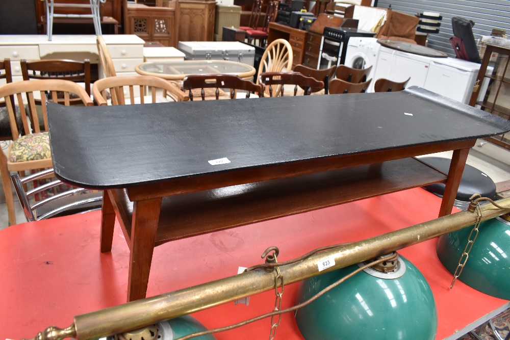 A vintage coffee table having shaped ply top