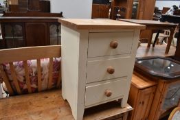 A part painted bedside chest of three drawers