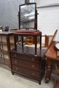 A Stag bedroom chest of three long drawers, width approx. 81cm, a similar stool and dressing table