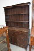 An early to mid 20th Century oak dresser in the traditional style, width approx. 122cm