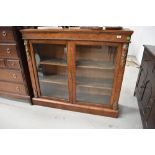 A Victorian Empire style cabinet having satinwood inlay and ormolu decoration