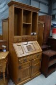 An Old Charm or similar bureau bookshelf in golden oak