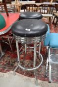 A pair of vintage chrome bar stools