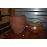 An Earthenware egg crock and a similar glazed pot