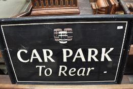 A large framed car park to rear (pub) sign