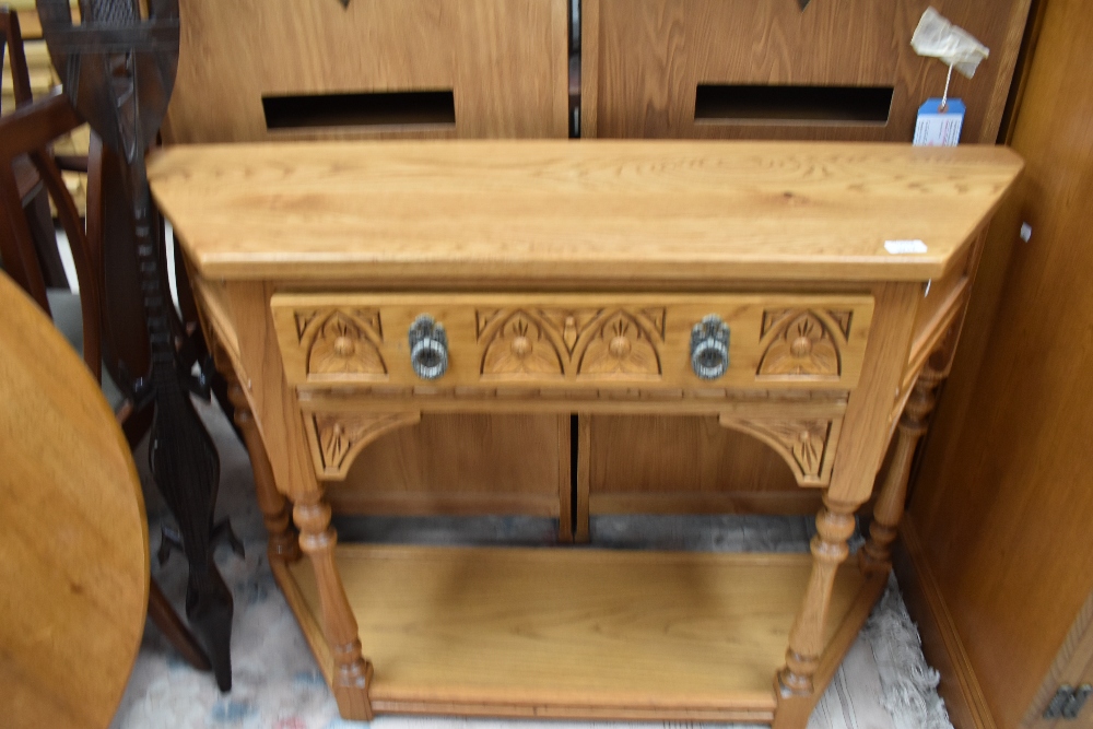 An Old Charm hall table in light oak