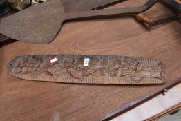 A carved piece of tribal art, length approx. 59cm