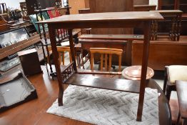 A Victorian hallway side table having carved mahogany frame with turned gallery supports