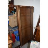 An Edwardian oak framed bed with irons