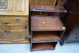 Two modern reproduction book shelves and a piano stool