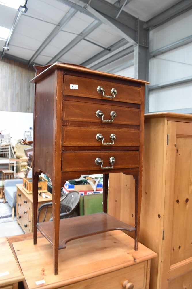 An Edwardian sheet music cabinet with drop fronted drawers, later handles