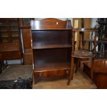A reproduction mahogany low shelf and whatnot