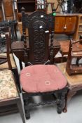 A period oak carved hall chair