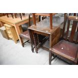 A traditional kitchen gate leg barley twist oak table