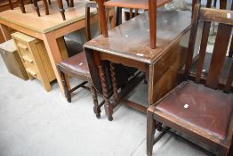 A traditional kitchen gate leg barley twist oak table