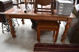 A Victorian oak dining table or desk having leather inset top, turned legs, approx. Dimensions 166 x