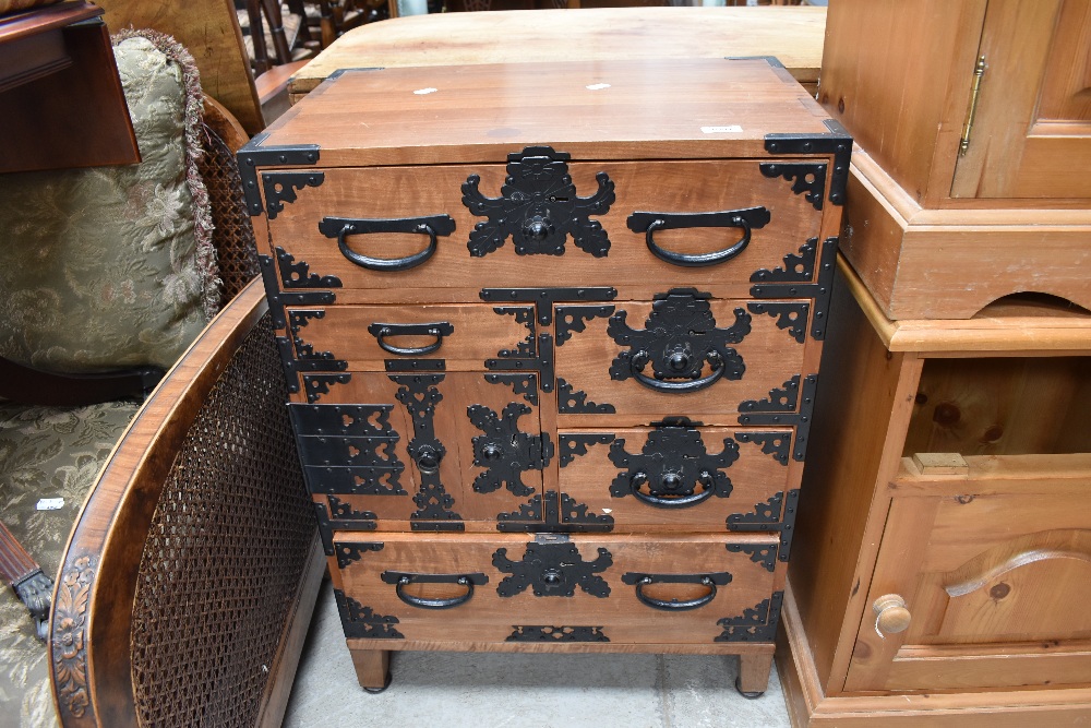 An Oriental style side cabinet of small proportions