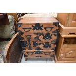 An Oriental style side cabinet of small proportions