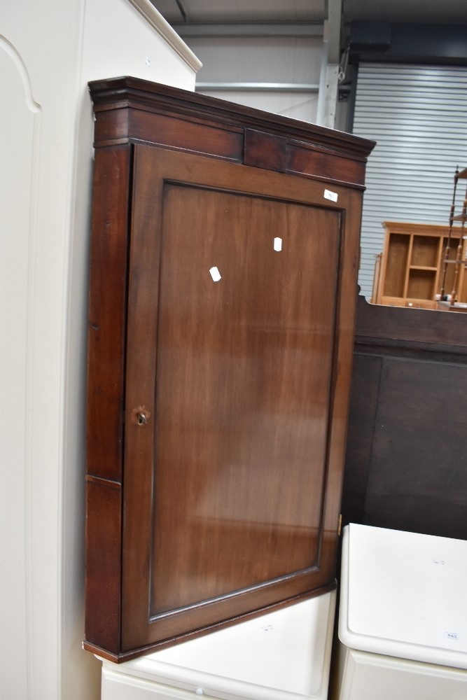 A 19th Century mahogany corner cupboard