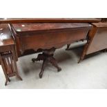 A 19th Century rosewood fold over tea table, having shaped apron and quadruple splay legs, width