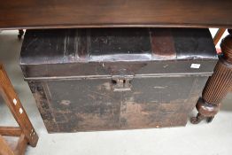 A traditional tin trunk having dome top