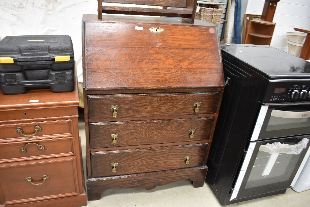 An early 20th Century oak bureau in the traditional style