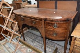 An Empire period side board or buffet bar having tapered legs with extensive inlay detailing