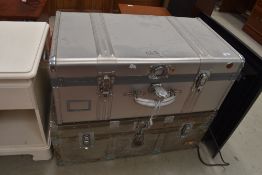 Two flight case style travel trunks